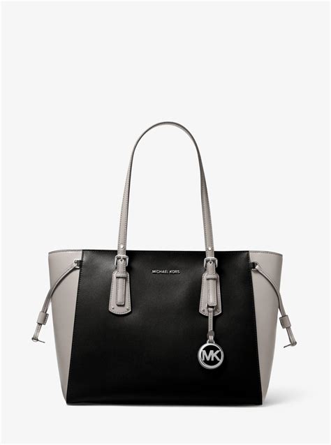 voyager medium two-tone logo tote bag by michael kors|michael kors two tone handbags.